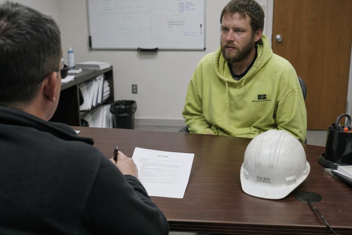 Recruiters reviewing candidate profiles together.